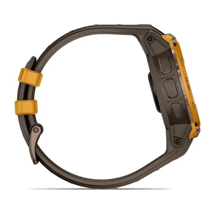 Garmin Instinct Crossover AMOLED watch with brown case and orange accents, side view