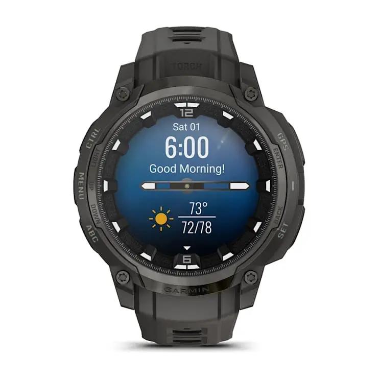 Garmin Instinct Crossover AMOLED smartwatch, rugged dark gray/black with round AMOLED display.