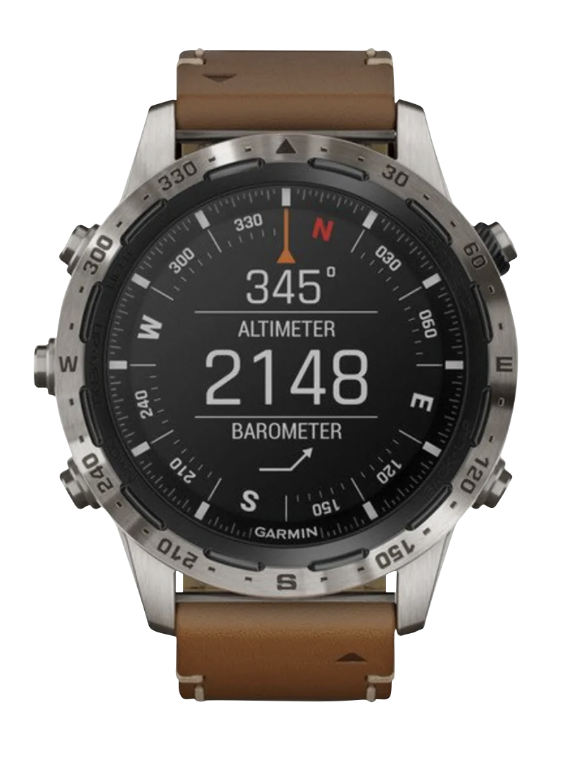 Garmin MARQ Adventurer men's luxury GPS smartwatch with brown leather strap and steel compass bezel.