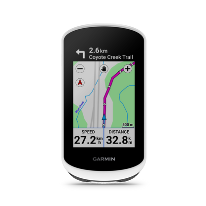 Garmin Edge Explore 2 bicycle computer with white bezel displaying turn-by-turn map and speed/distance metrics