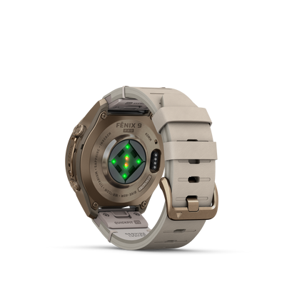 Garmin Fenix 9 Pro inReach AMOLED smartwatch, 43mm gold titanium case with bone leather and cream/gray silicone bands.