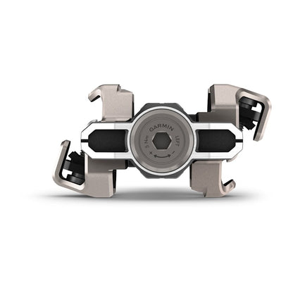 Garmin Rally XC110 single-sensing power meter pedal unit, metallic beige-gray with black accents.