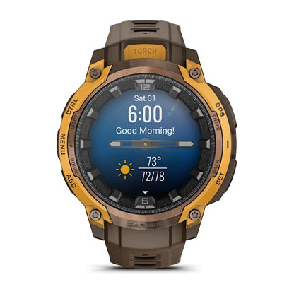 Garmin Instinct Crossover AMOLED smartwatch with brown strap and orange bezel, displaying time and weather.